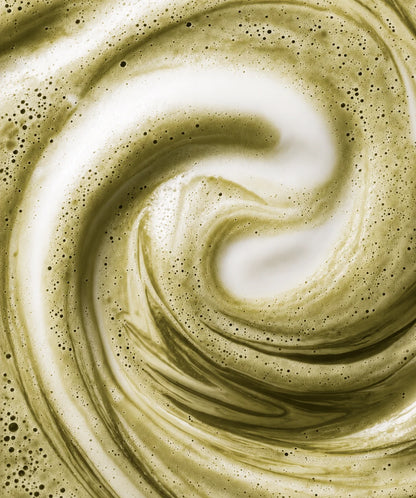 Tourbillon de poudre de feuilles d'olivier dans le lait — couleur or vert | The Originea